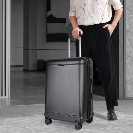 best lightweight suitcases sale UK  - A man with Matte Metallic Suitcase Pic